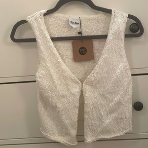 a cute white vest from the boutique Sky to Moon! it is a size medium!
